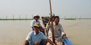 Four men in a fishing boat on Lake Tonle Sap