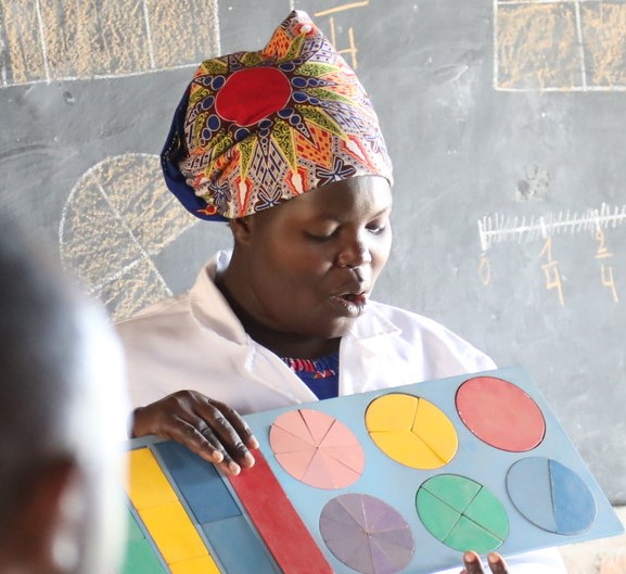 Teacher with learning materials