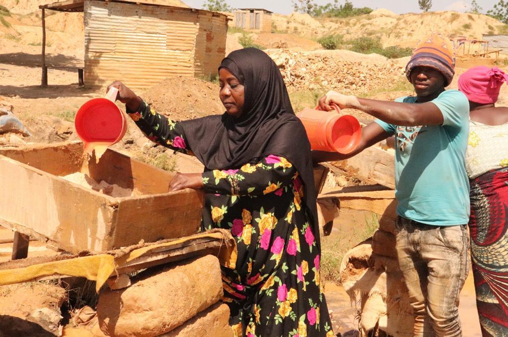 Asia Hussein processing minerals at a mining centre