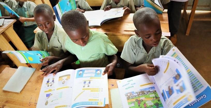 Rwandan primary school children with text books