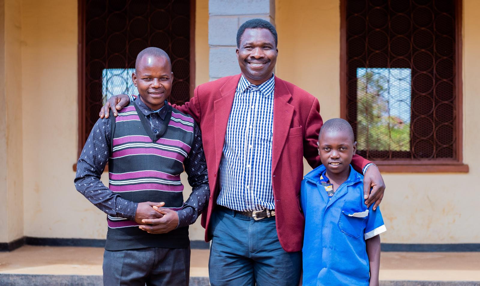 Teacher Peter, VSO volunteer Theo and student Thoko.