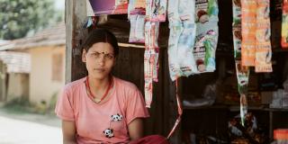 Nepalese woman outside her shop