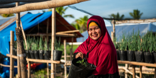 Woman smiling with organic crops