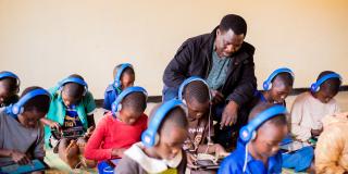 Theo sits in the learning centre with a student