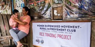  Joceyln with her granddaughter in the rice trading store