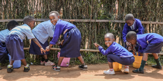 Chlidren learn how to clean their clothes