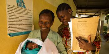 Local nurse with a mother and a newborn baby