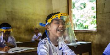 A schoolgirl in Myanmar back at school.