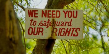 Sign reads: We need you to safeguard our rights