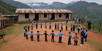 Children hold hands in circle