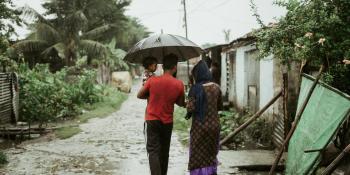 Family walks through rain