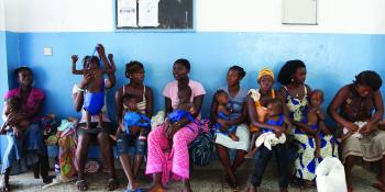 Mothers with their babies waiting at a clinic in Sierra Leone | VSO Mothers with their babies waiting at a clinic in Sierra Leone | VSO