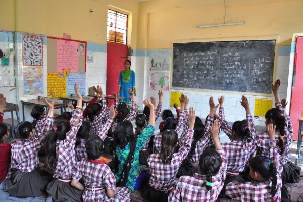 All girls excited to answer the question asked in a school in Delhi