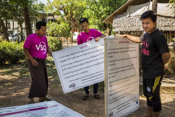 Volunteer in Myanmar. Community volunteers set up the disaster risk management committee signboard at Kyatkathone Village, Kyike Ma Yaw Township, Mon State.