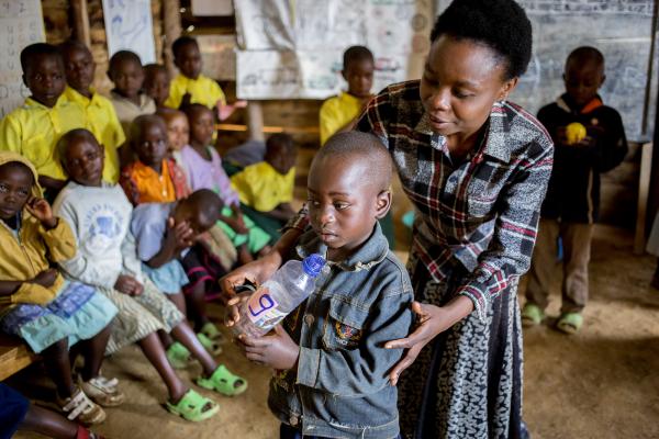 Teacher Josephine Nyirampuhwe with Pupil  Pacifique Raiss