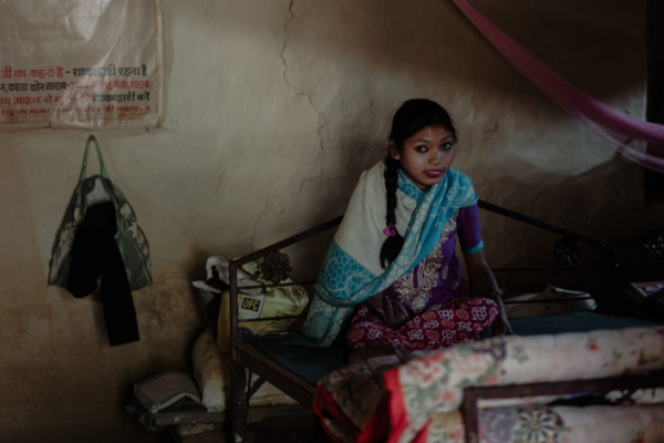 Rabina at home - without a wheelchair she cannot walk or go to school.