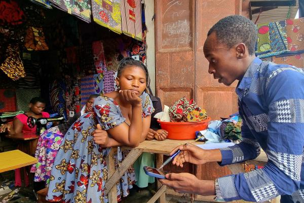 Young seamstress at her stall