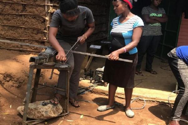 Girls learning metal work