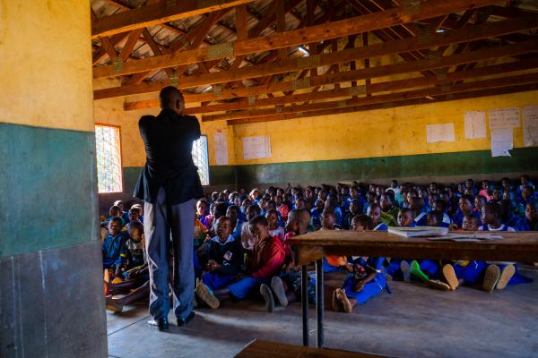 Class 2 teacher Peter stands in front of his class of 200 students