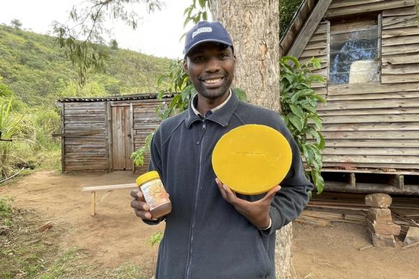 Beekeeper holding honeycomb