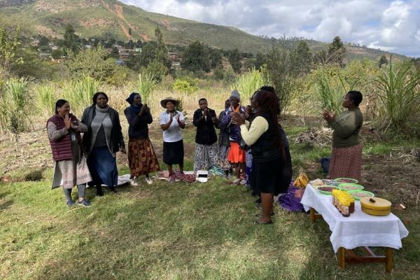 Women singing in field