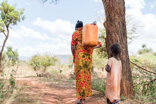 Mother and child walk for water