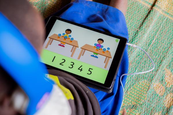 A student learning on an educational tablet.