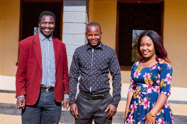 VSO volunteer Theo, teacher Peter and VSO volunteer Prisca.