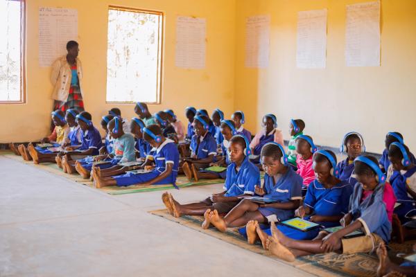 Students learning in the spacious learning centre on educational tablets.