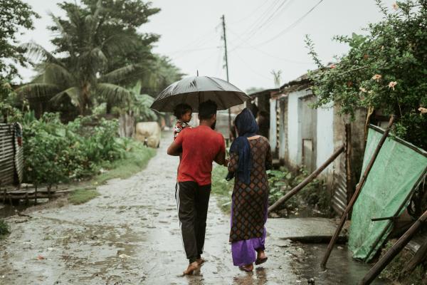 Family walks through rain