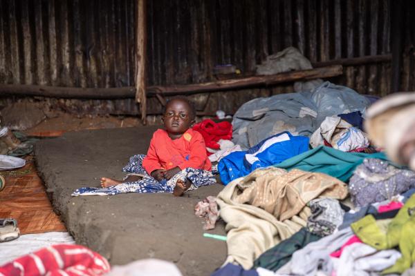 Doreen, waste picker's baby inside her home