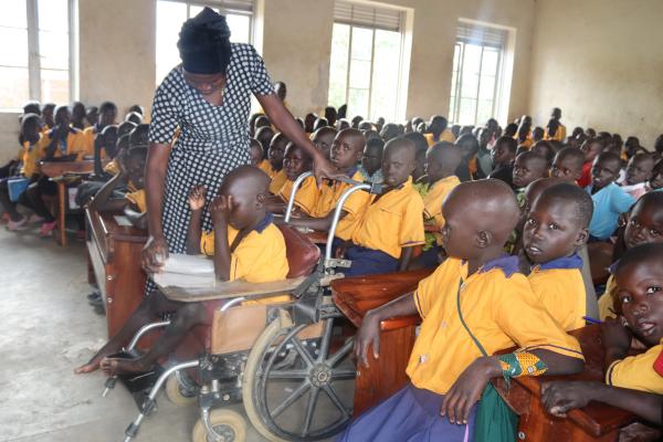 Teacher with disabled child.