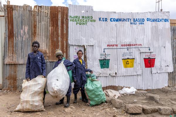 Doreen, Beth and Elizabeth at the buy-back centre wearing personal protective equipment provided by VSO. ©VSO/Paul Wambugu