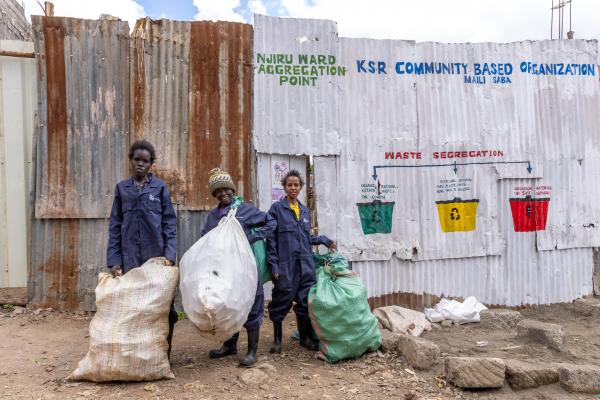 Doreen, Beth and Elizabeth at the buy-back centre wearing personal protective equipment provided by VSO. ©VSO/Paul Wambugu