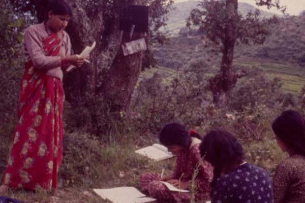 Learning sat on the floor in a field in the 1980s