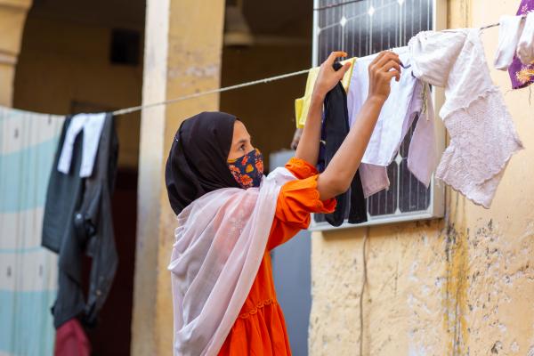 Pakistani child hanging washing