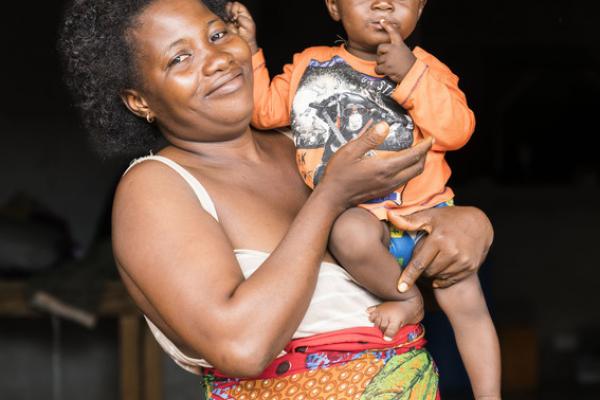 Sento Timbo holds her one-year-old, Shaku, whom she very nearly lost in terrible flooding following a catastrophic mudslide in Freetown, Sierra Leone.